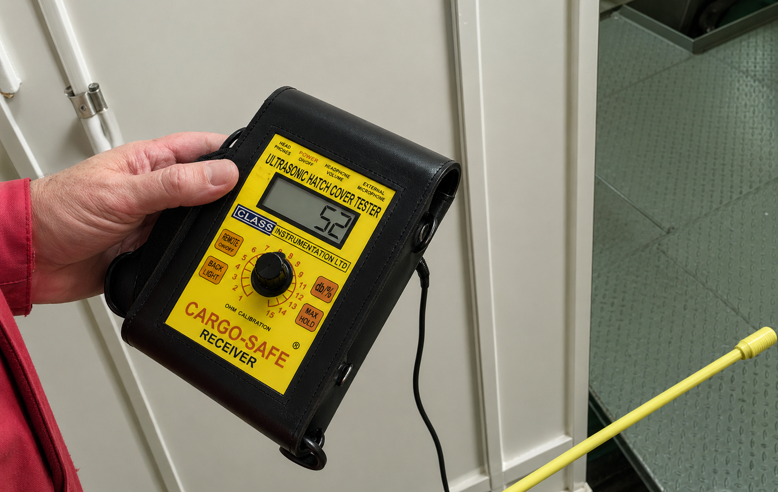 Marine surveyor using the CARGO-SAFE PLUS to test a watertight door on a vessel